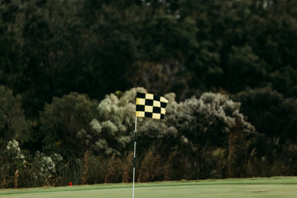Golfers walking a fairway