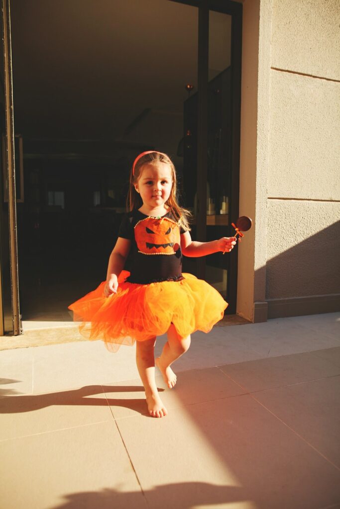 Children in costumes trick or treating